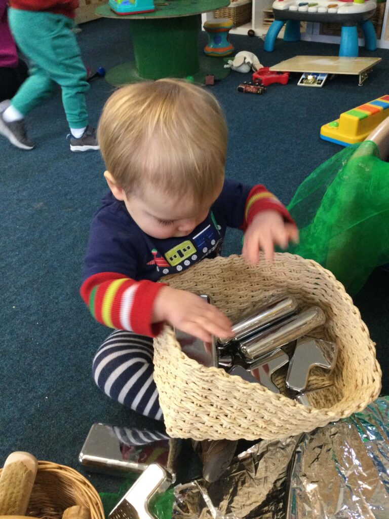 kid playing with toys at Alton College Nursery in Alton, Guildford