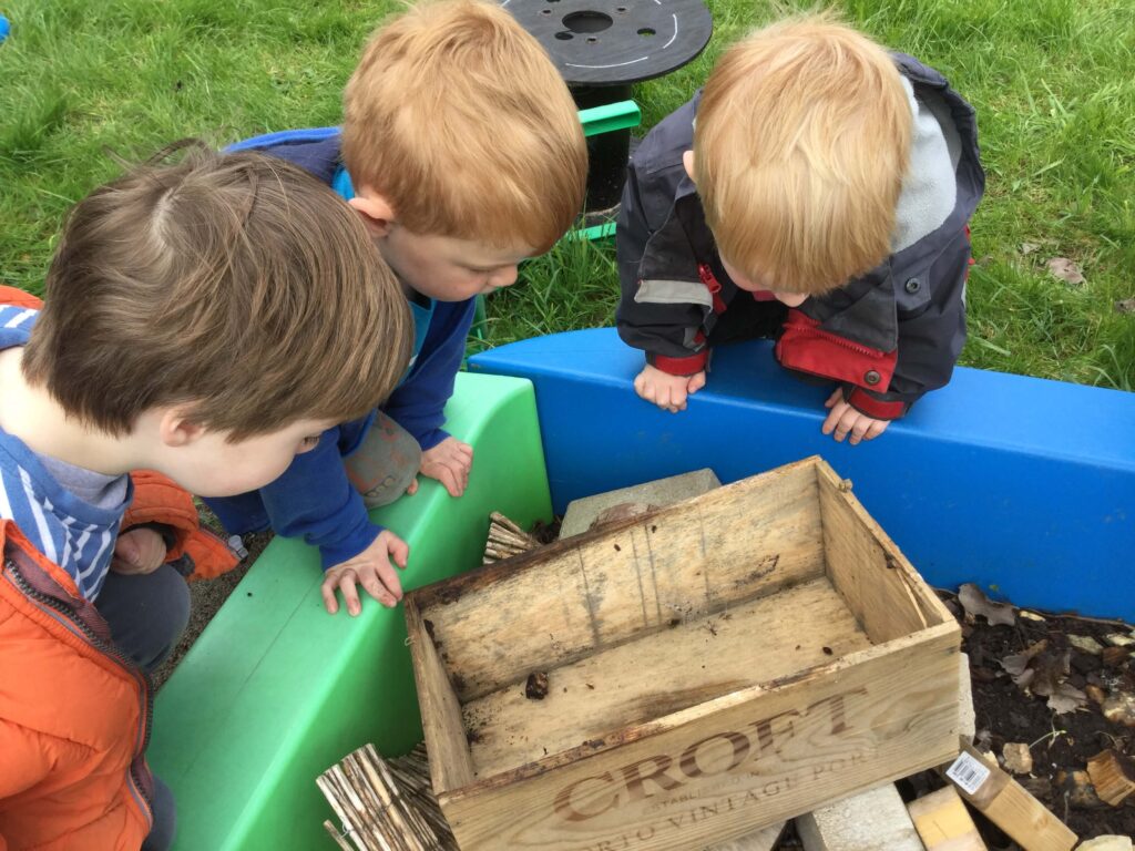 Children playing in the garden at Alton College Nursery