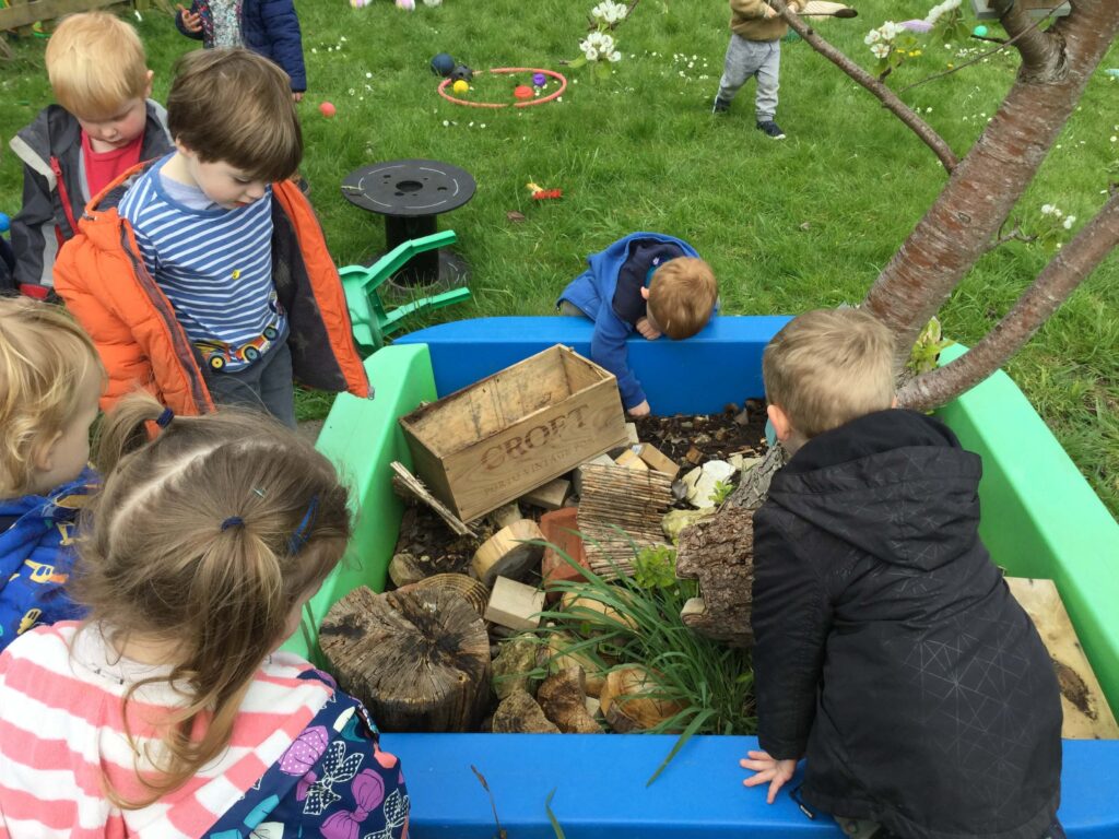 Children playing in the garden at Alton College Nursery